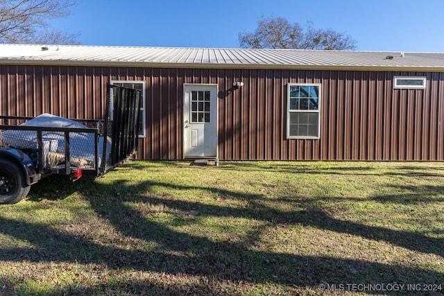 view of home's exterior with a lawn