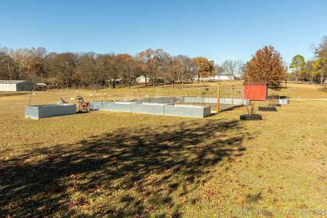 view of property's community with a yard