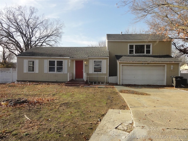 front of property with a garage