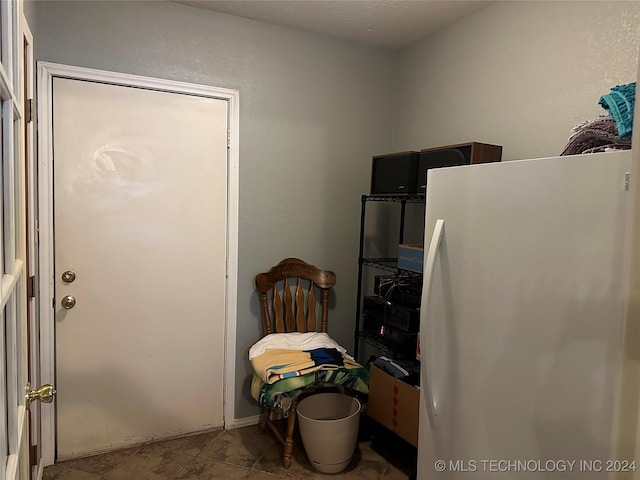 interior space featuring white fridge