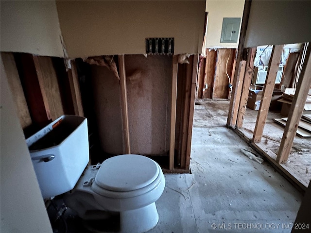 bathroom with toilet and electric panel