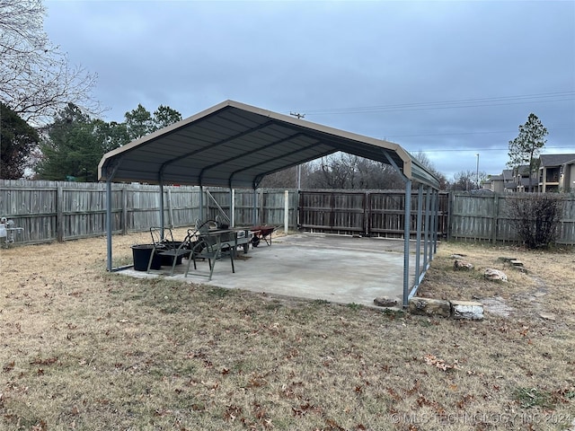 exterior space with a yard and a carport