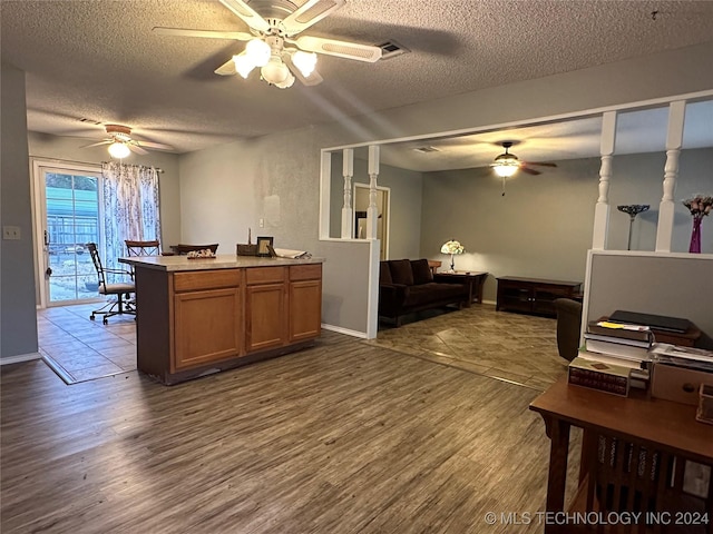 interior space with dark hardwood / wood-style flooring and a textured ceiling