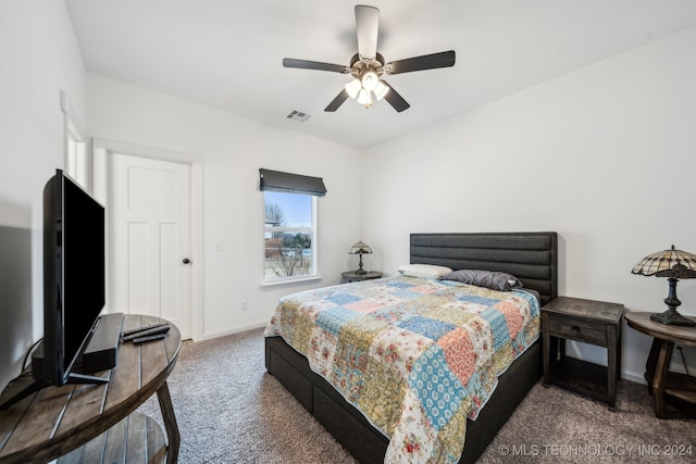 bedroom with dark carpet and ceiling fan