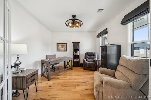 office with wood-type flooring and ornamental molding