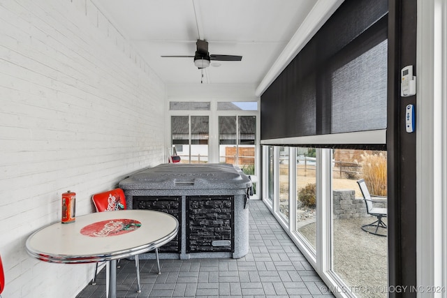 sunroom / solarium with ceiling fan