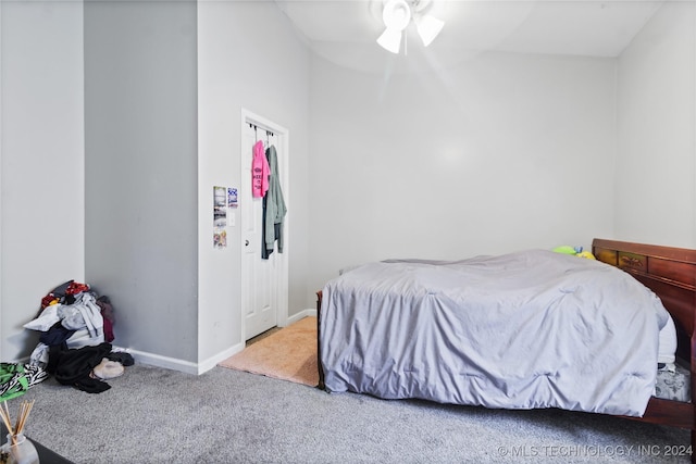 bedroom featuring carpet, a closet, and ceiling fan