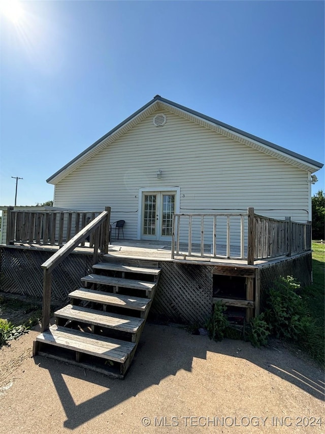 back of property with french doors and a deck