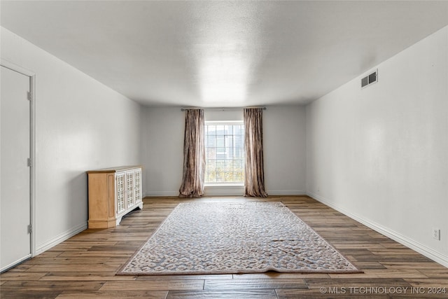 empty room featuring hardwood / wood-style flooring