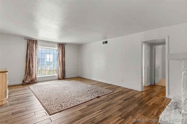 unfurnished room featuring light hardwood / wood-style floors