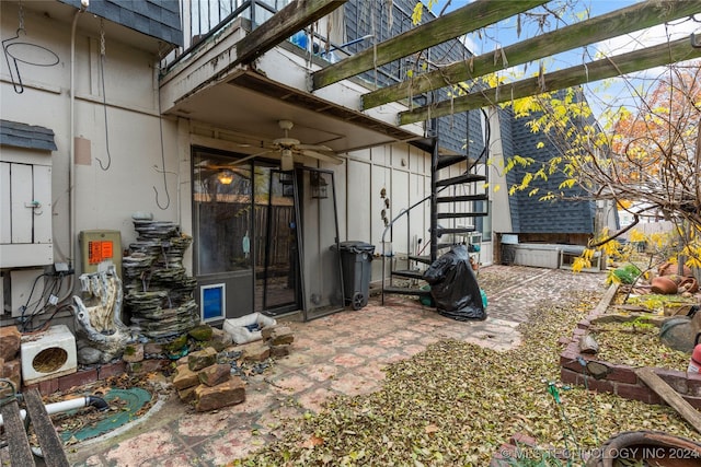 exterior space with ceiling fan and a patio