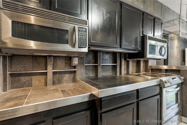 kitchen with tasteful backsplash and stainless steel appliances