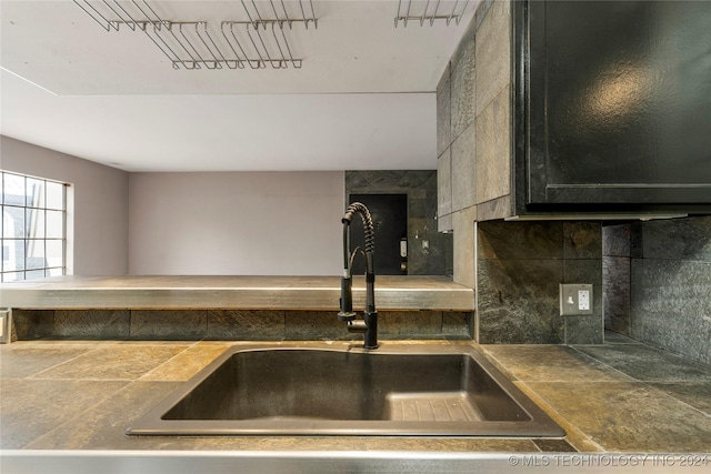 kitchen with tasteful backsplash and sink