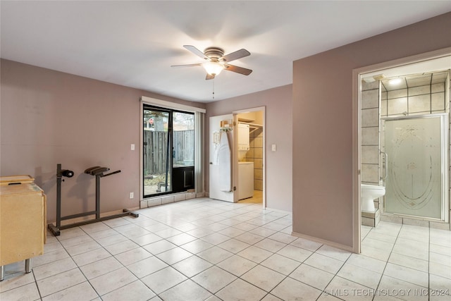 tiled empty room featuring ceiling fan