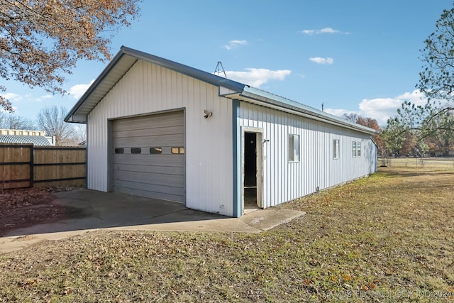 garage with a yard