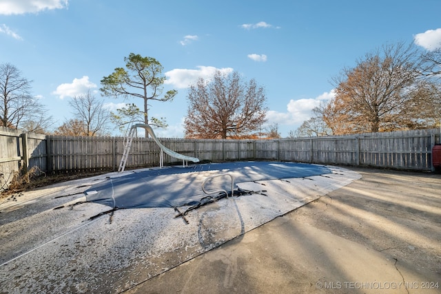 view of pool featuring a water slide