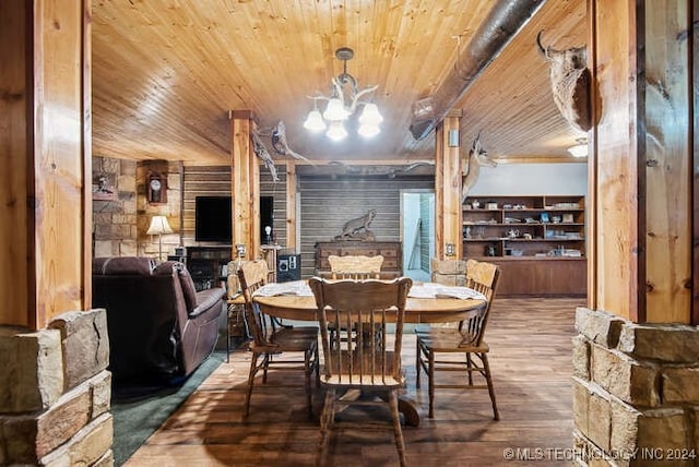 dining room featuring built in features, an inviting chandelier, wood ceiling, and hardwood / wood-style flooring