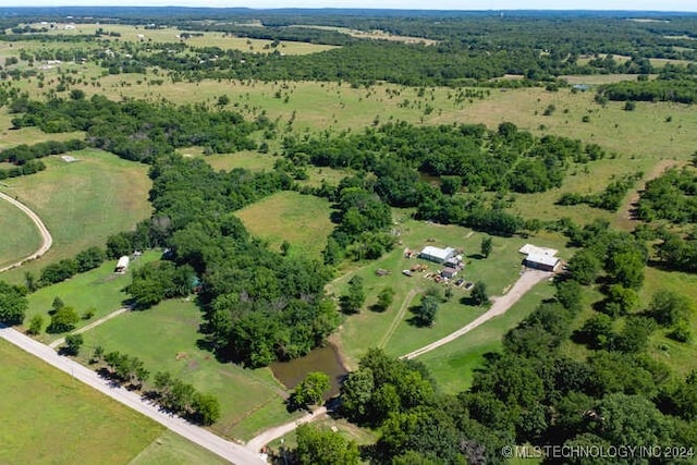 birds eye view of property with a rural view