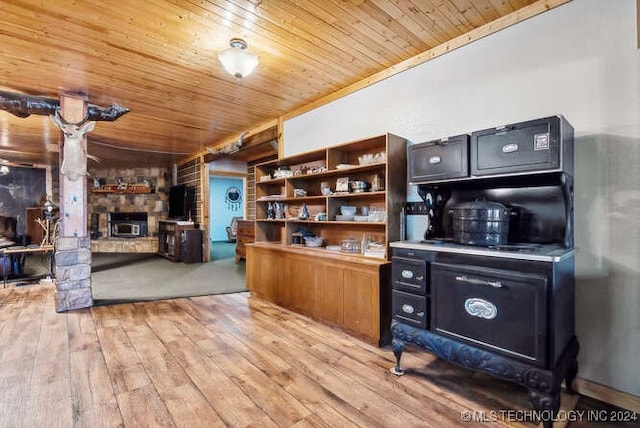 home office with ornamental molding, wood ceiling, and light hardwood / wood-style floors