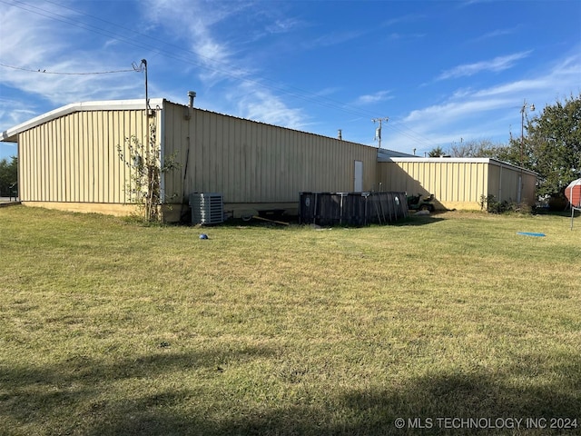 view of yard with central AC