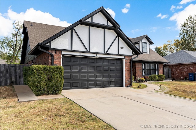 tudor home featuring a garage