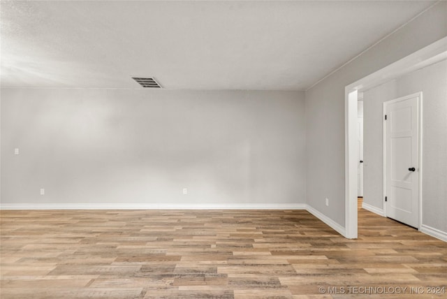 spare room featuring light hardwood / wood-style floors