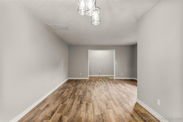 empty room with hardwood / wood-style floors