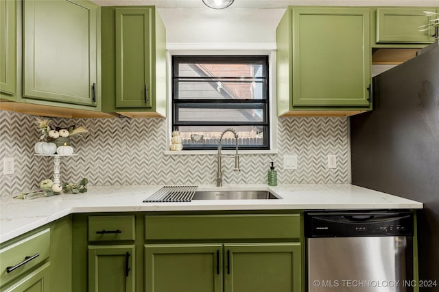 kitchen with green cabinets, sink, and stainless steel dishwasher