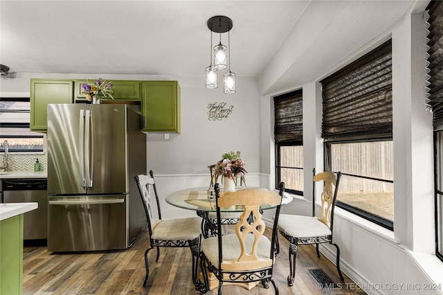 dining room with wood-type flooring