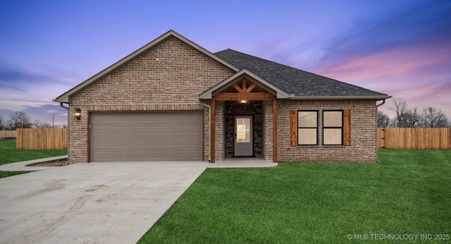 view of front of house with a lawn and a garage