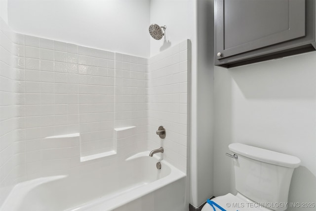 bathroom with shower / bathtub combination and toilet