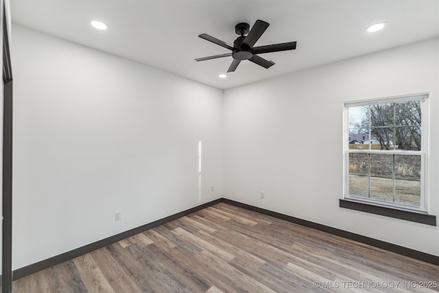 empty room featuring recessed lighting, ceiling fan, baseboards, and wood finished floors