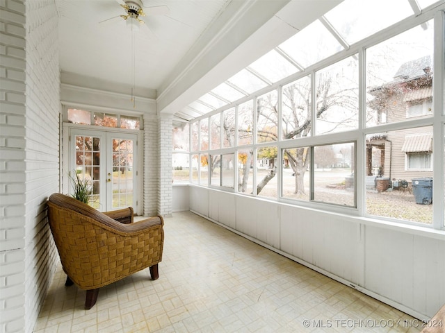 sunroom with ceiling fan and french doors