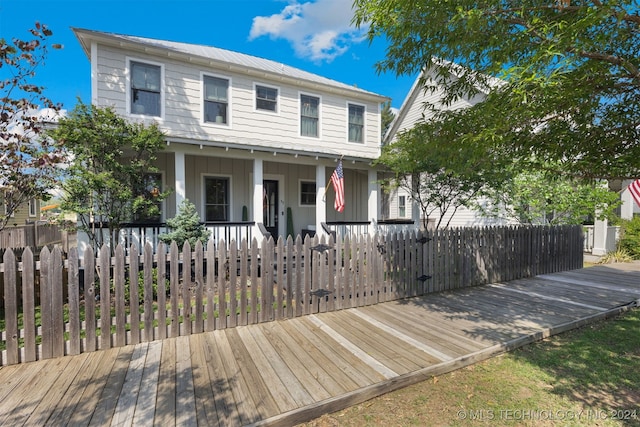 view of front of property with a wooden deck