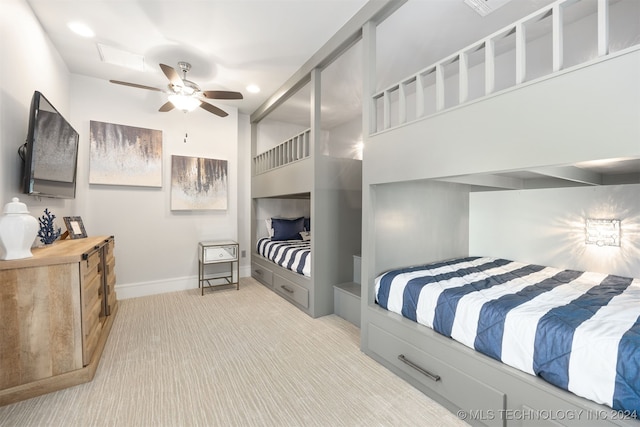 bedroom featuring ceiling fan and light carpet