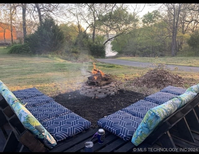 view of yard with a fire pit