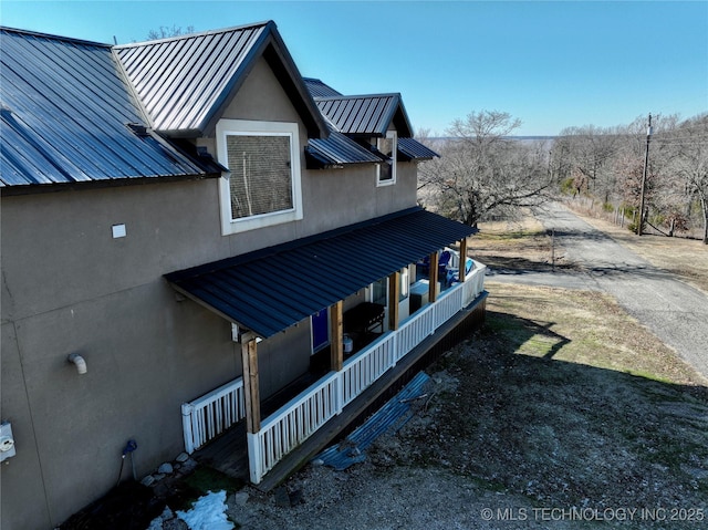 view of home's exterior featuring covered porch