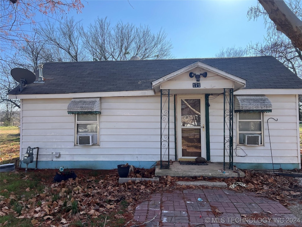 view of front of home with cooling unit