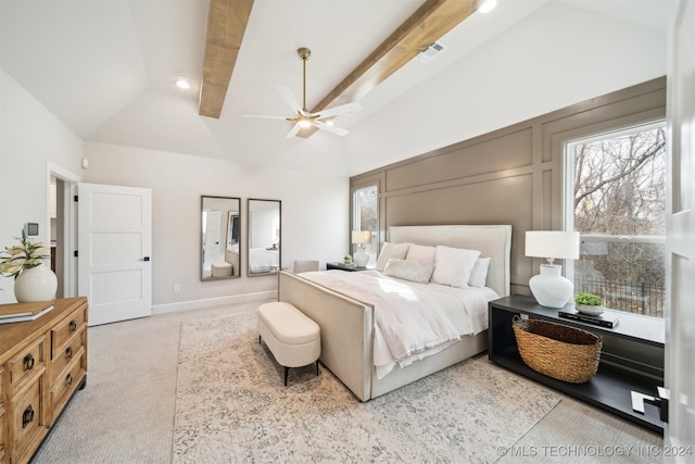 carpeted bedroom featuring ceiling fan, beamed ceiling, and high vaulted ceiling