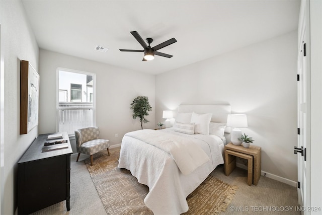 bedroom with ceiling fan and carpet floors