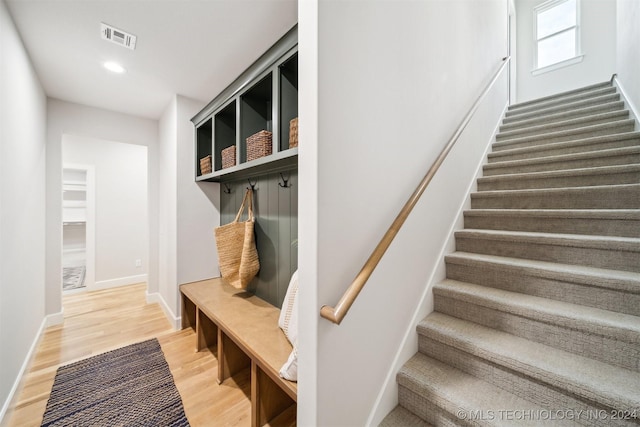 mudroom with hardwood / wood-style flooring