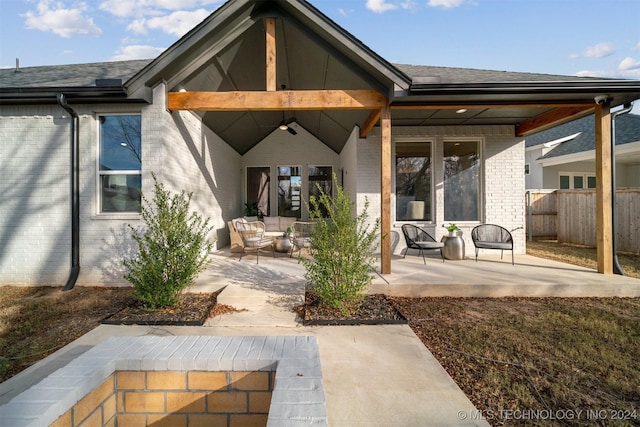 rear view of property with an outdoor hangout area and a patio area