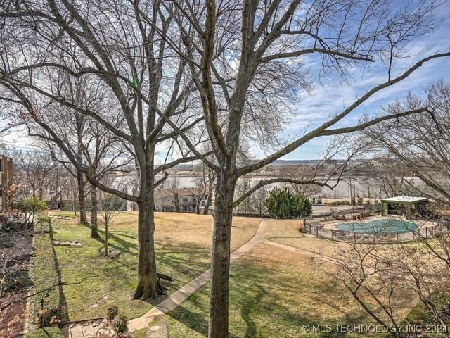 view of yard with a covered pool