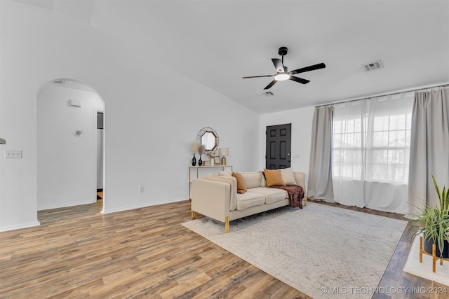 living room featuring wood-type flooring and ceiling fan