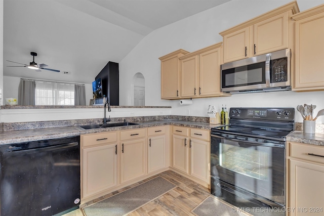 kitchen featuring black appliances, sink, vaulted ceiling, ceiling fan, and light hardwood / wood-style floors