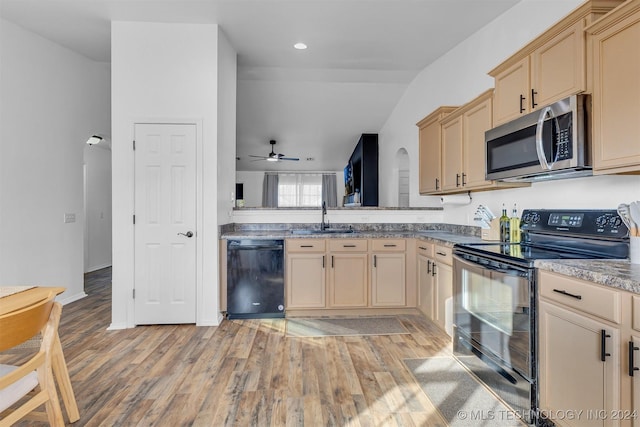 kitchen featuring light brown cabinetry, ceiling fan, sink, black appliances, and light hardwood / wood-style floors