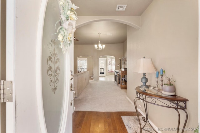 hall with hardwood / wood-style flooring