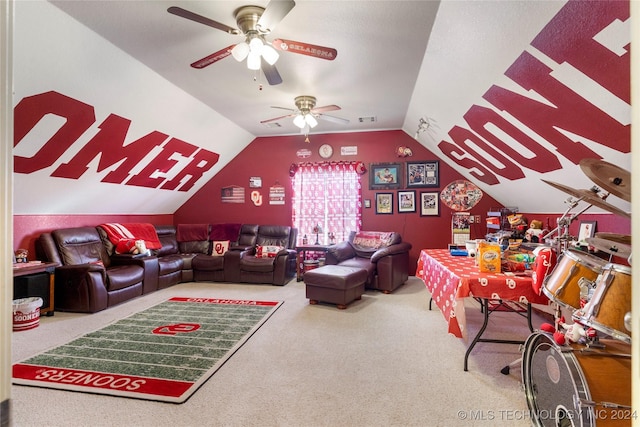 carpeted living room featuring ceiling fan and vaulted ceiling