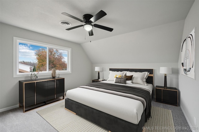 carpeted bedroom featuring ceiling fan and lofted ceiling