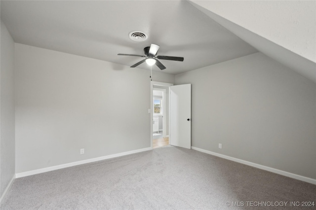 bonus room featuring ceiling fan, carpet floors, and vaulted ceiling